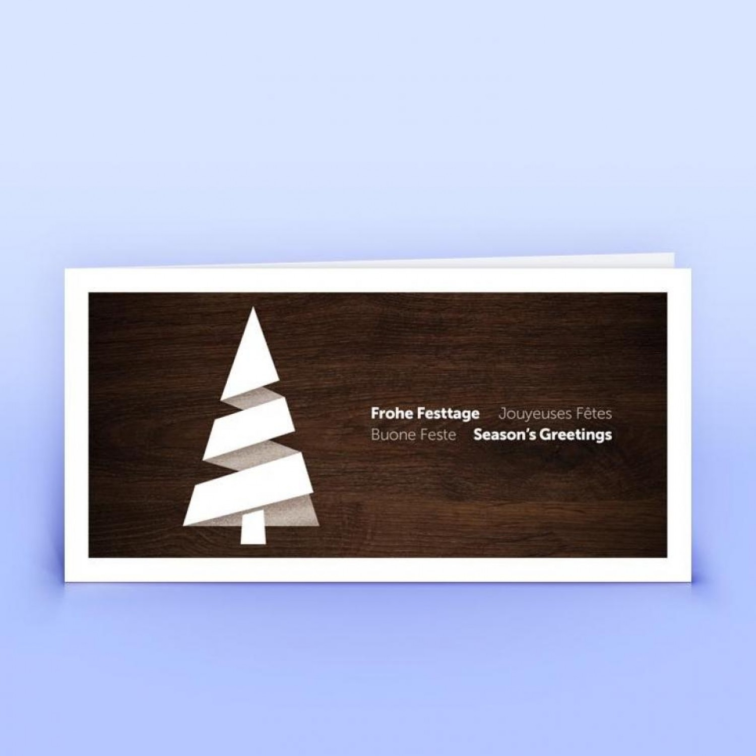 Viersprachige Weihnachtskarte stilisierter Christbaum auf Holzdekor » eco-cards
